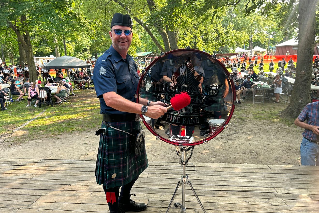 Rich Gordon in kilt and uniform with the Highland Creek Pipe Band, at a Highland games